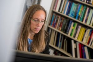 Kiona Ogle at her computer