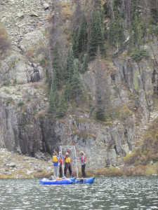 Scientists coring a lake